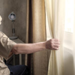 Elderly using sheer curtains